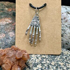 Skeleton Hand Necklace for Halloween. Creepy, Fun Silver Toned on Black Cord.